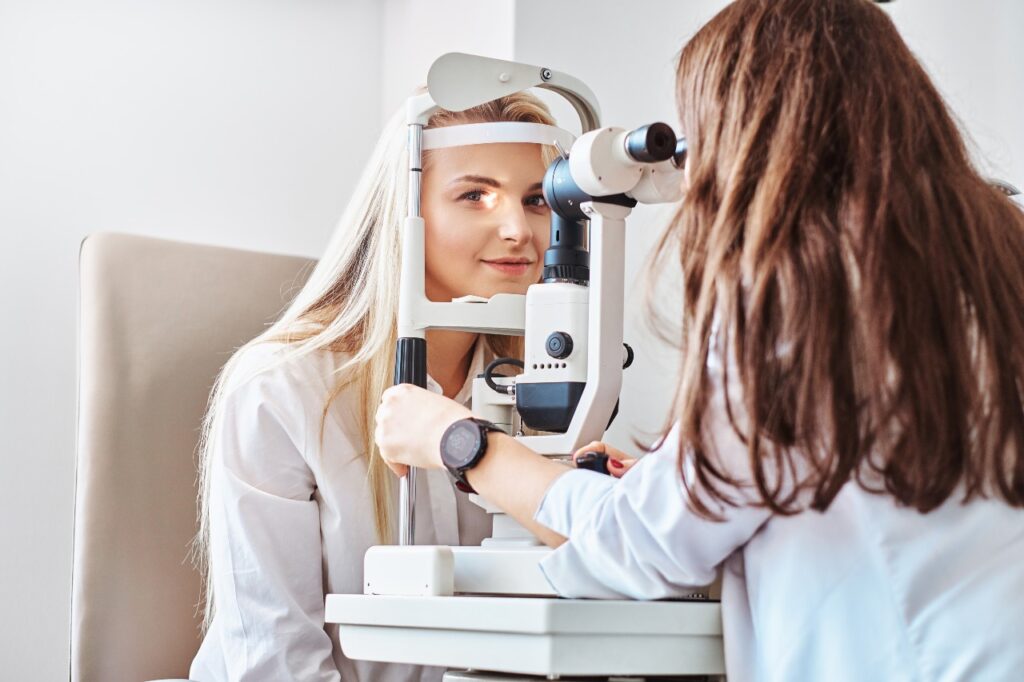 Doctor giving eye exam to patient