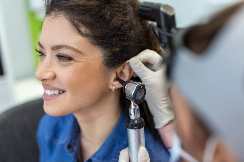 Young woman getting a hearing exam