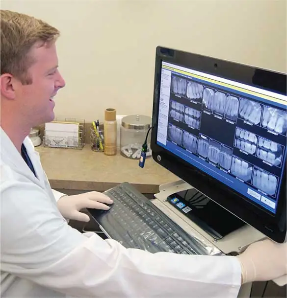 Dentist using DentiMax Dental Imaging Software